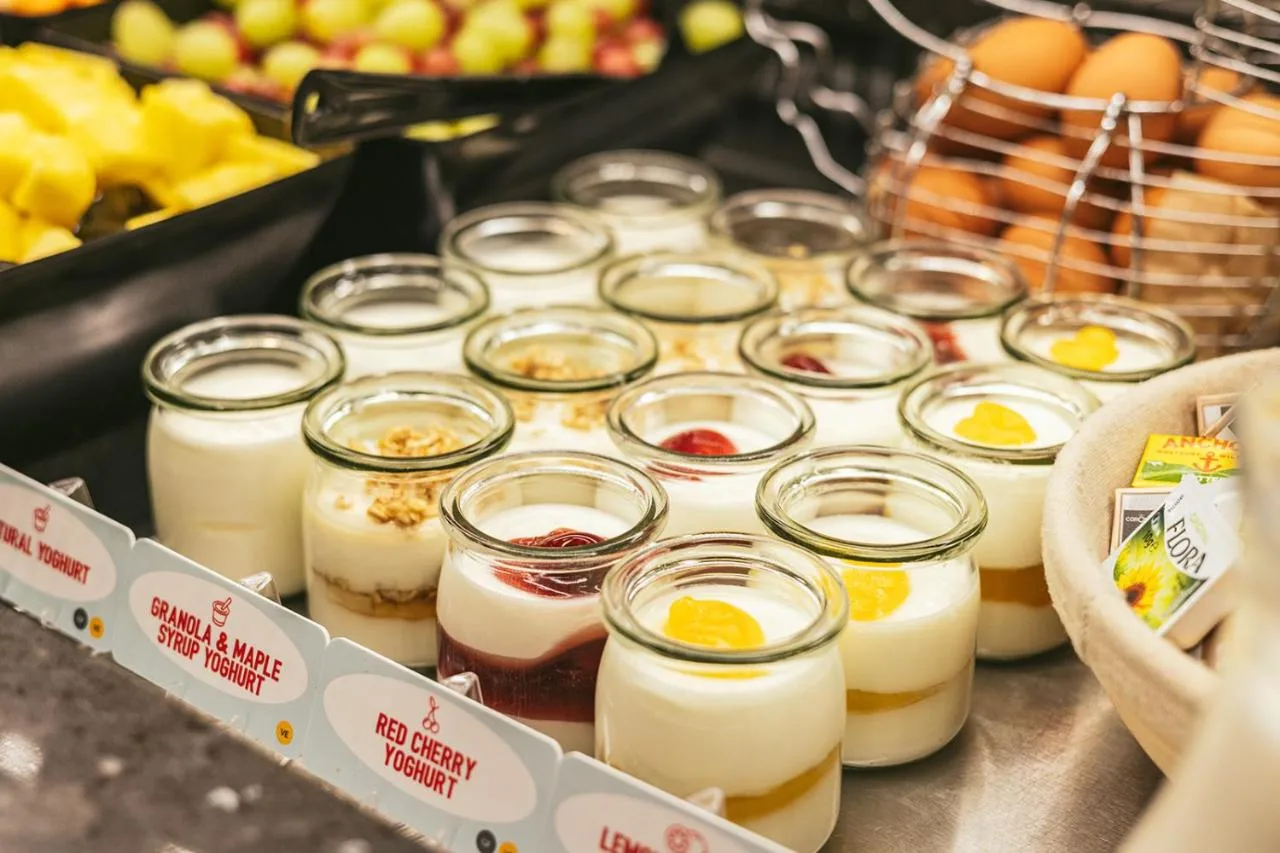 a bunch of jars filled with eggs and fruit at Point A Hotel Glasgow in Glasgow